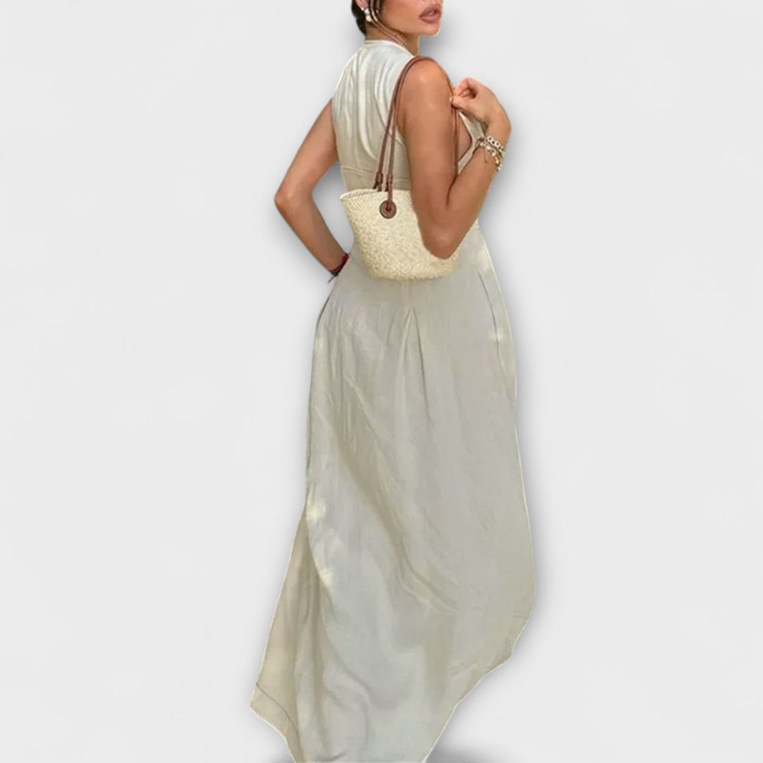 Kratka obleka brez rokavov s plisiranjem in tesnim krojem midi