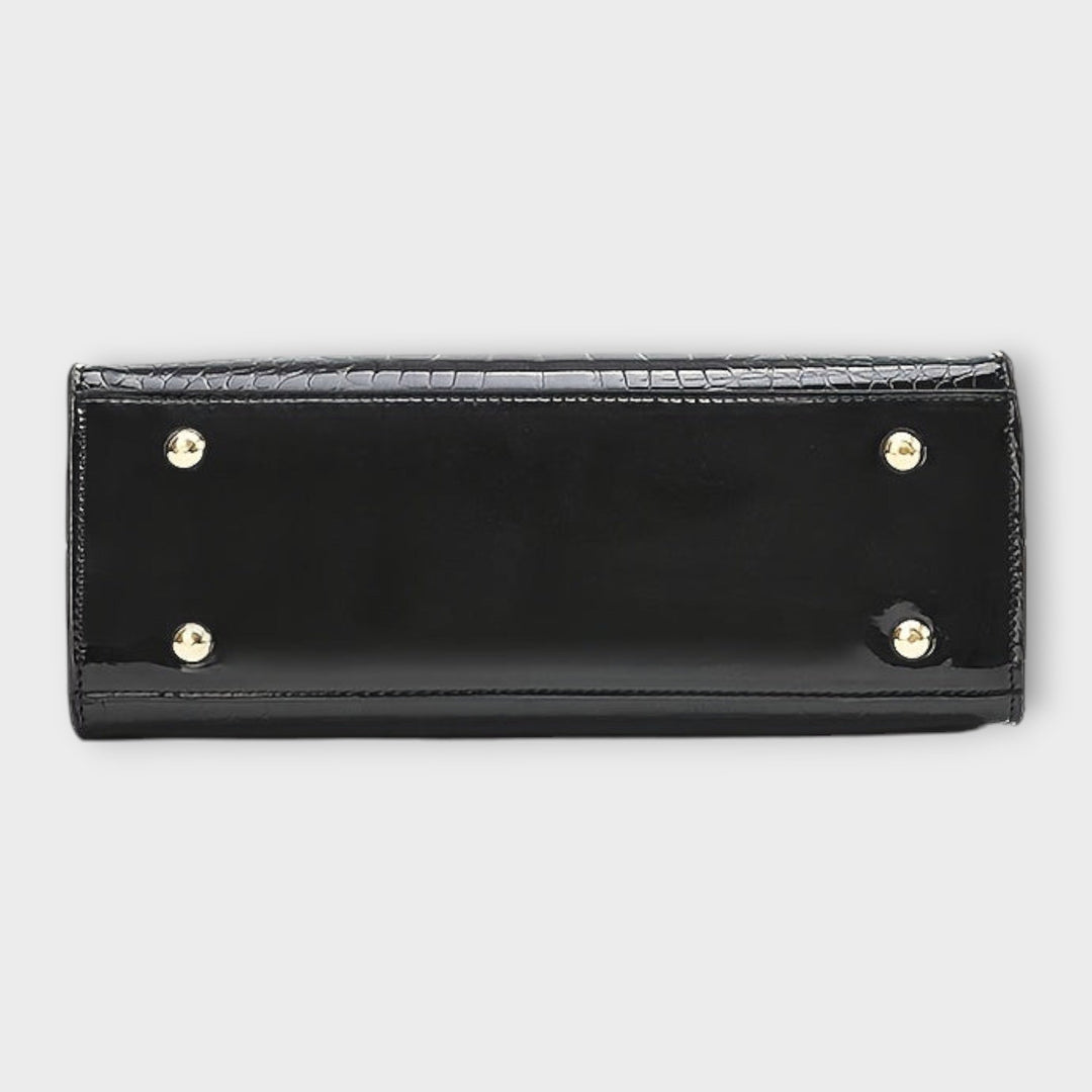 Cécile. - Sijajna torbica z vzorom krokodila