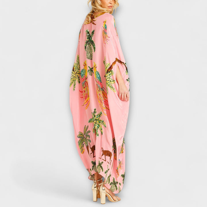 Linda - Impresivna obleka z asimetričnimi naramnicami in potiskom kokosovih palm
